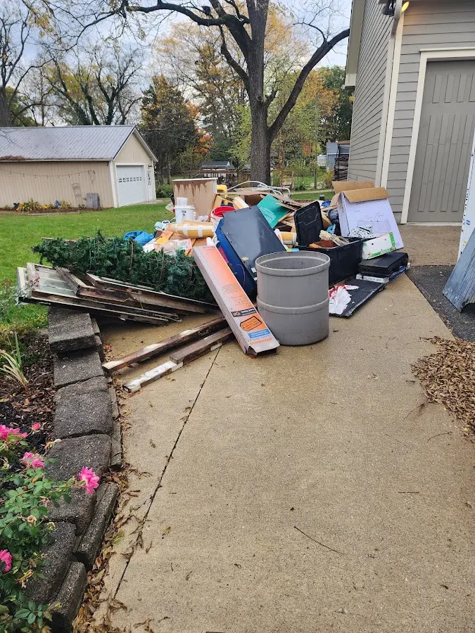 Dumpster being loaded with debris for 30 Yard Dumpster Rental in Unicoi